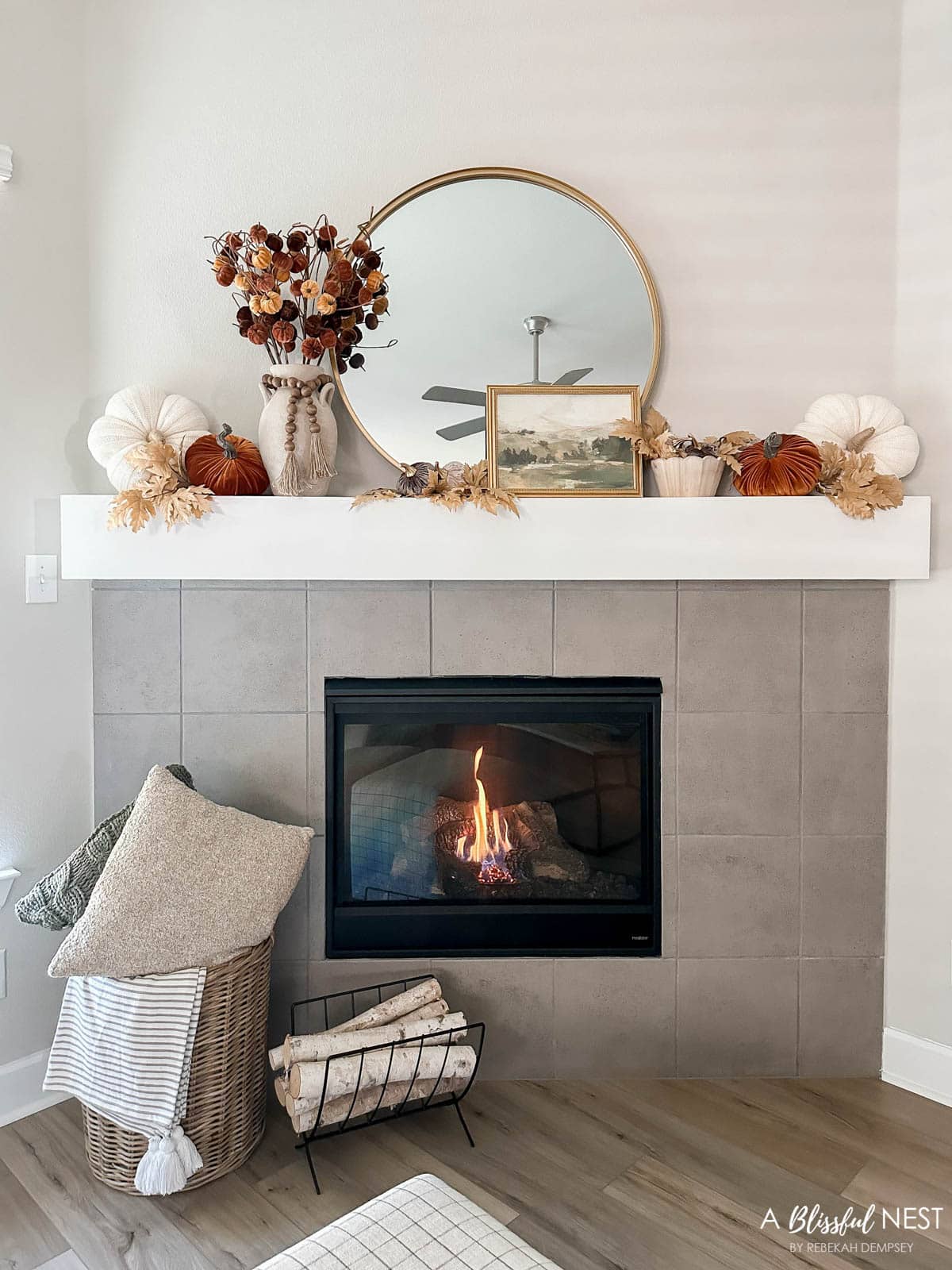 fall mantel with a cozy fire burning