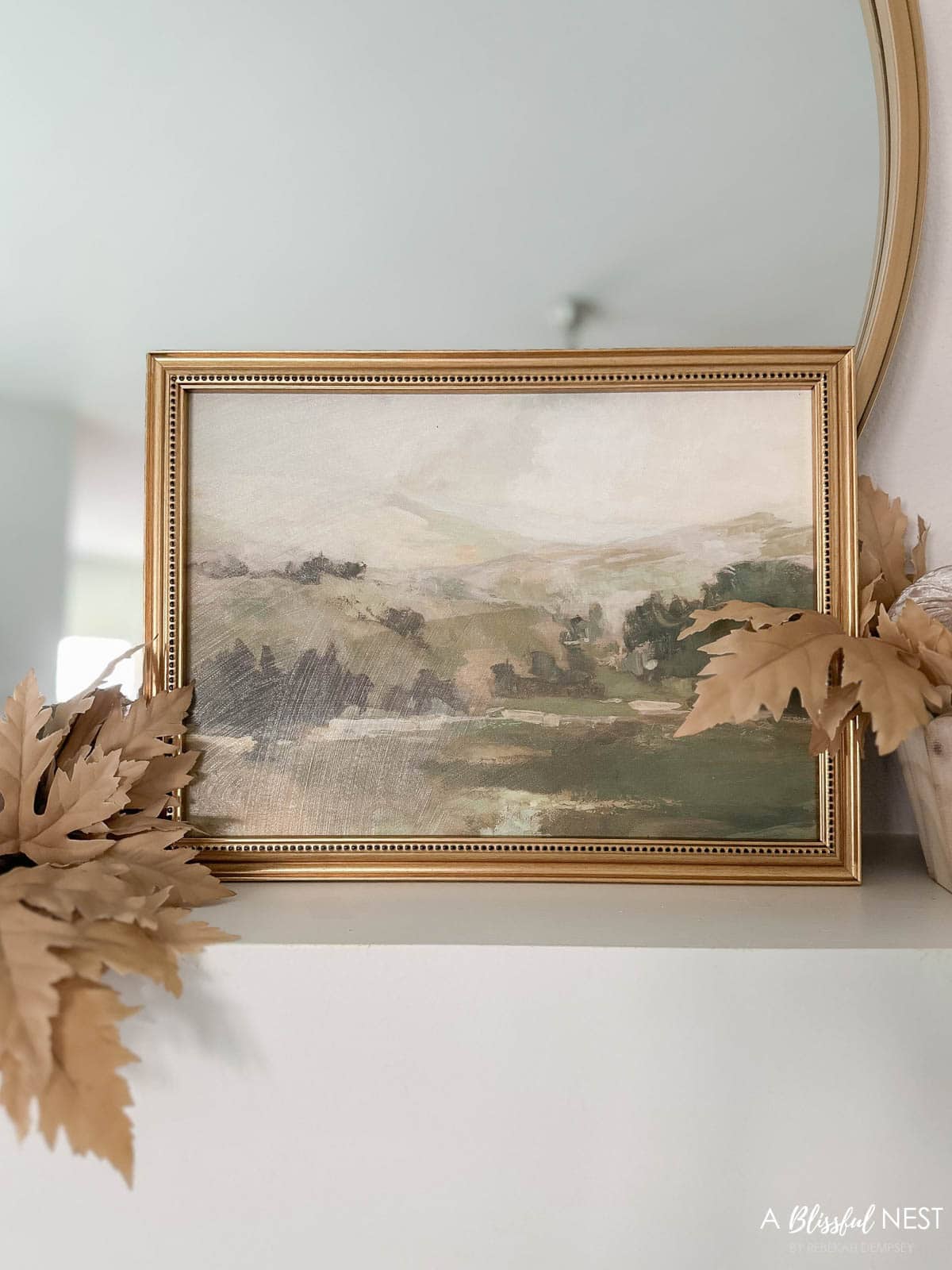 landscape art on a canvas in a gold frame