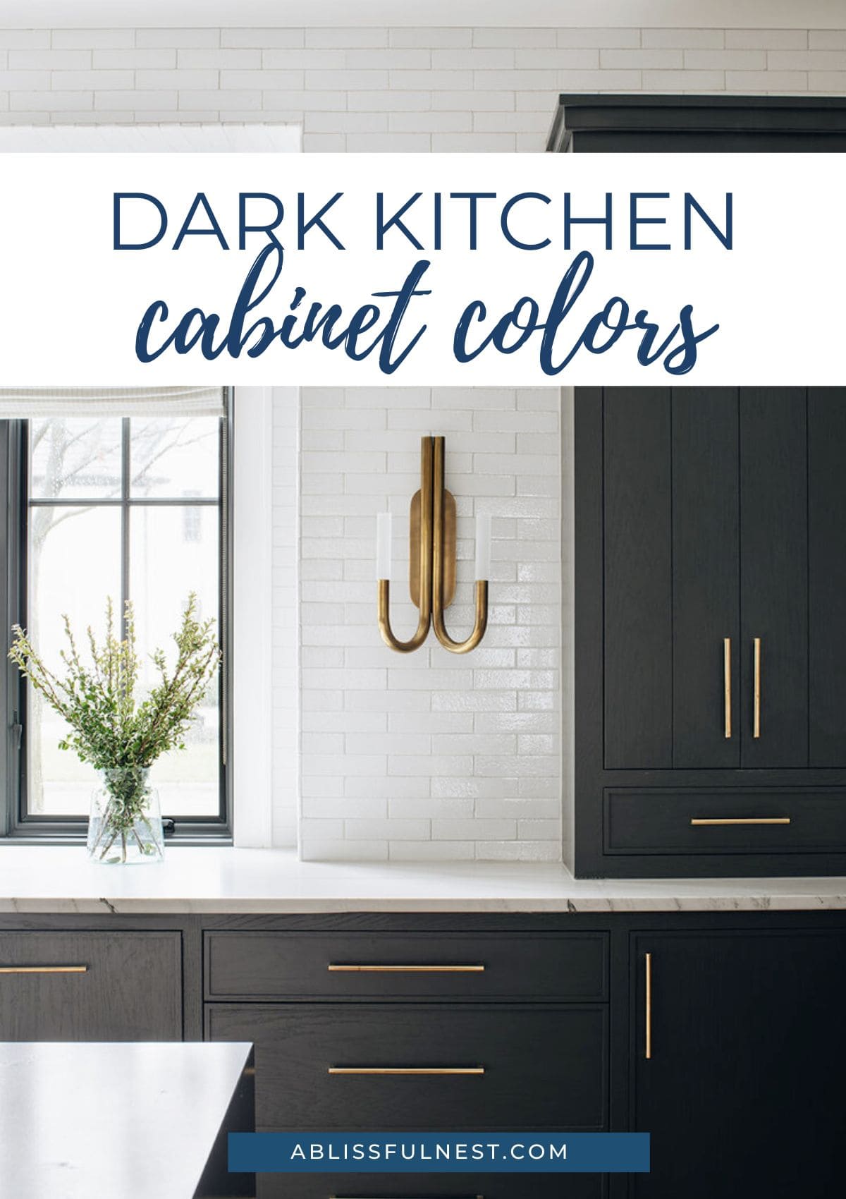 black cabinets with white counter tops and long gold cabinet pulls.