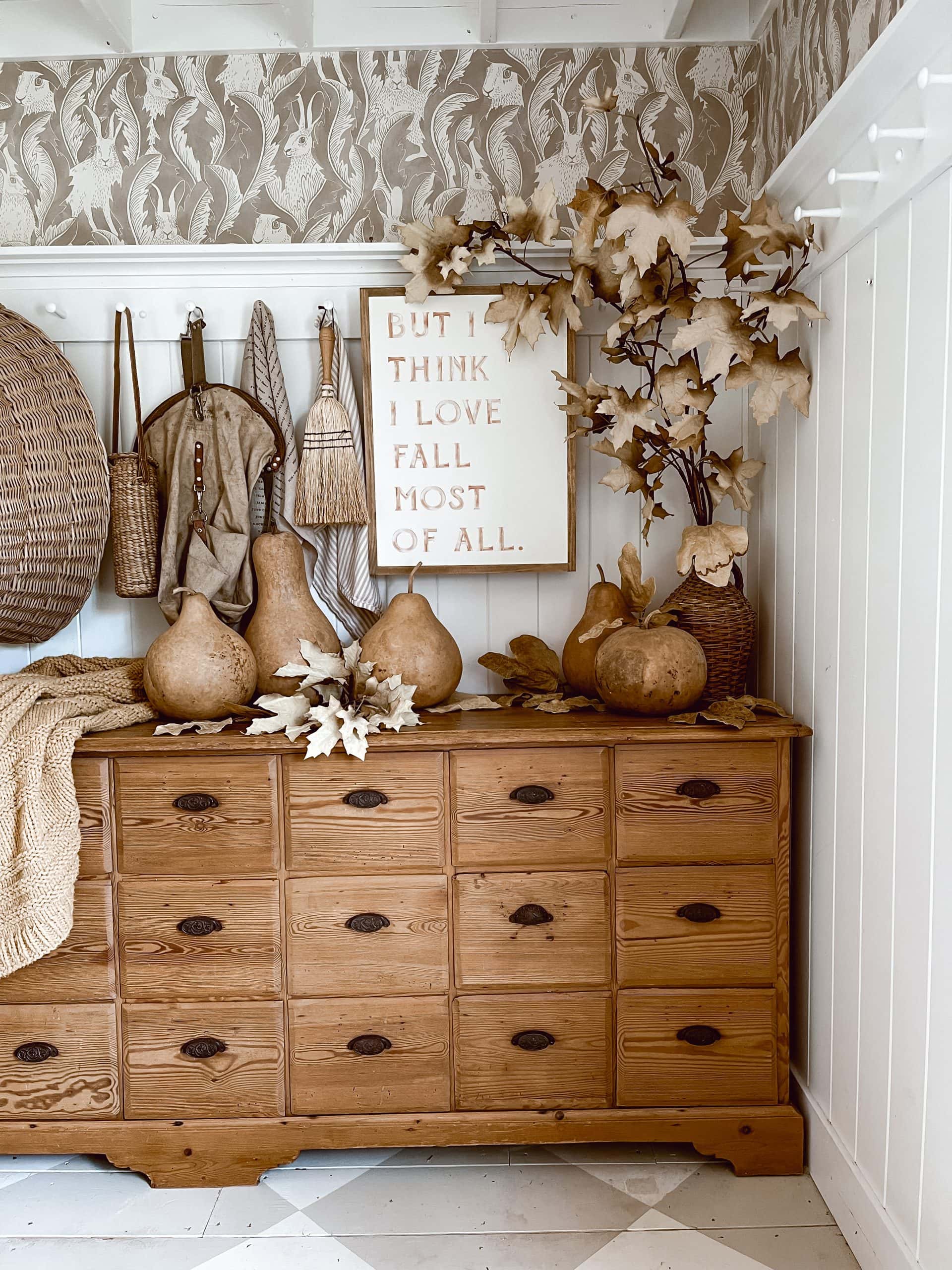 rustic dresser with oversized goards and fall leaves