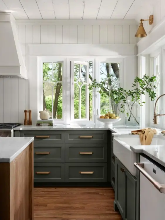 dark green kitchen cabinets with gold hardware