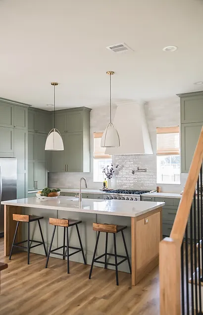 light sage green kitchen cabinets with white kitchen hood