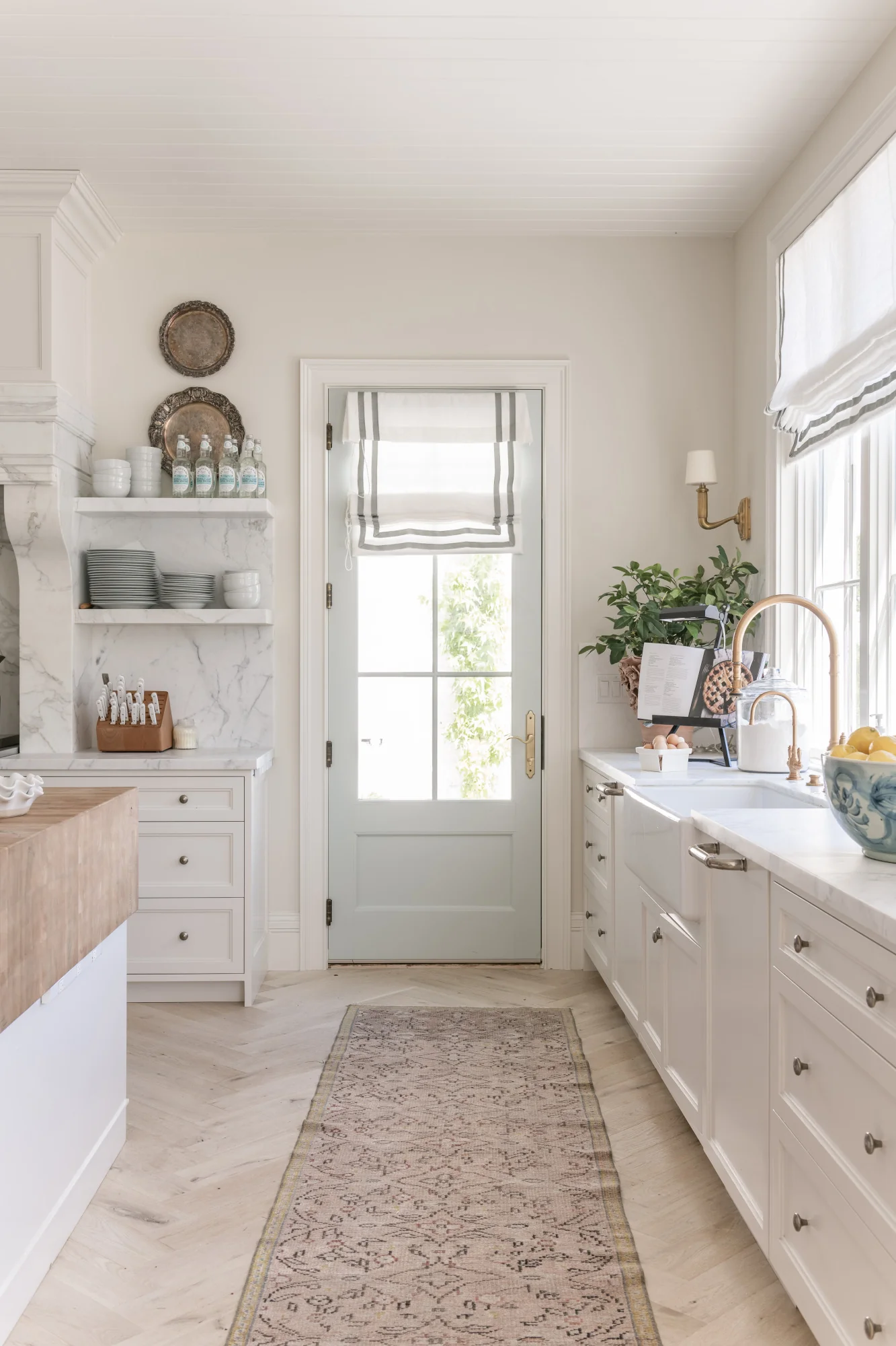 white kitchen with soft blue backdoor