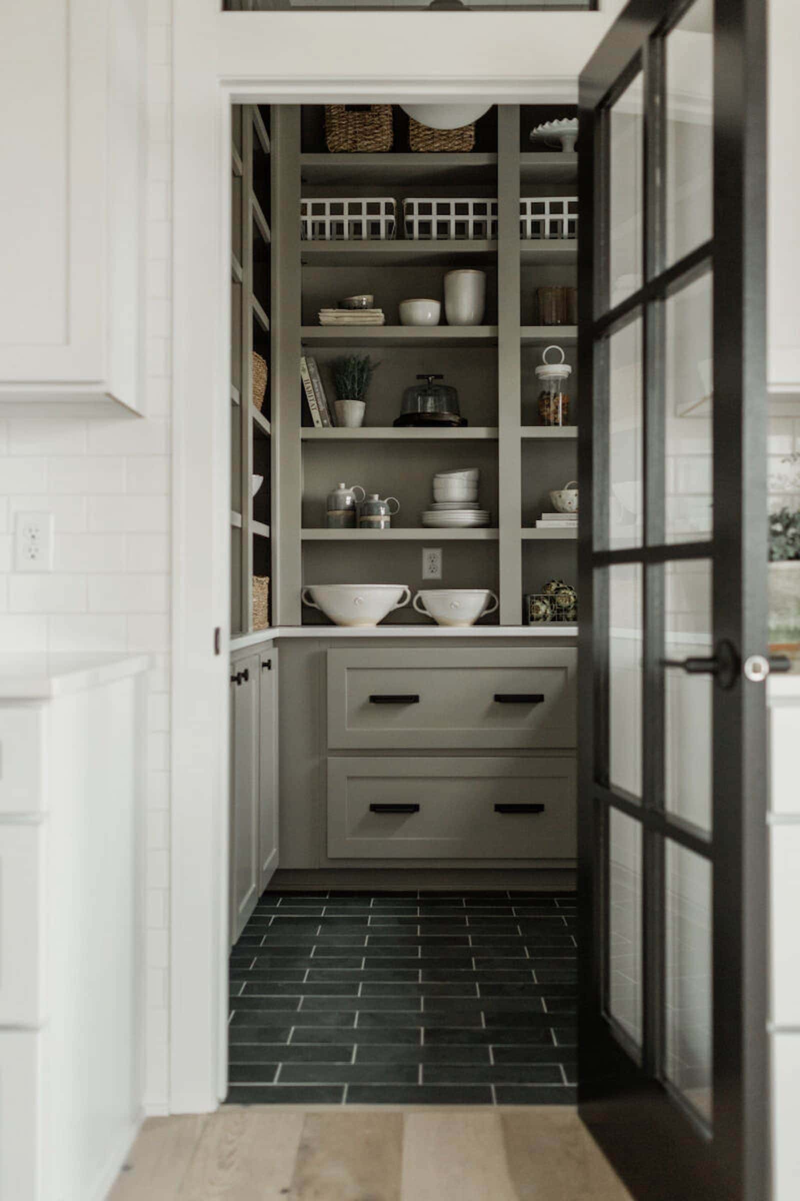 moss green pantry cabinet colors with black hardware