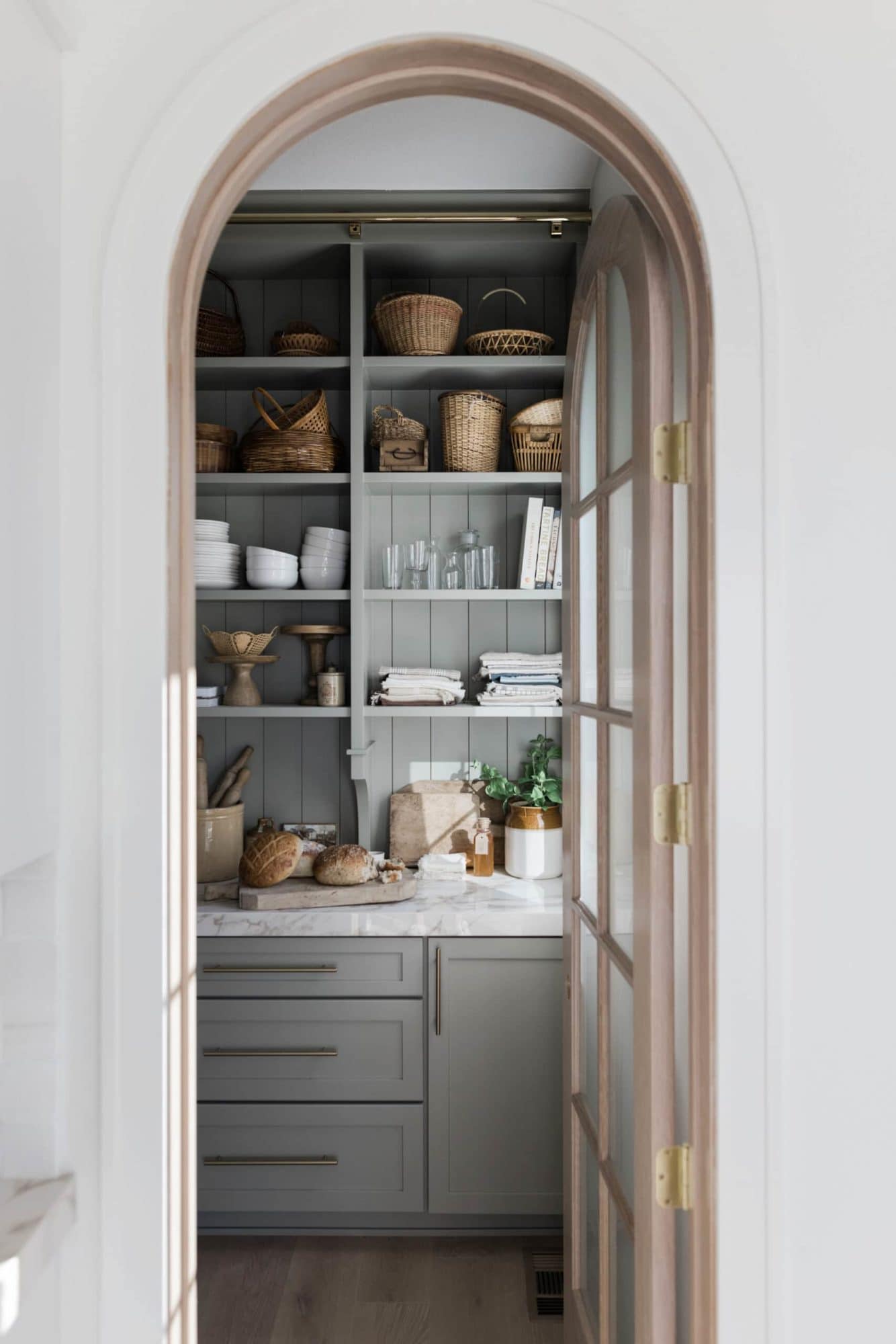 gray pantry cabinets with white counters