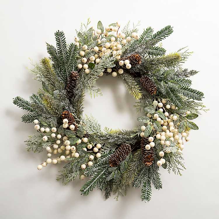 This white berry pinecone wreath is the perfect, neutral holiday wreath for your front door! #ABlissfulNest