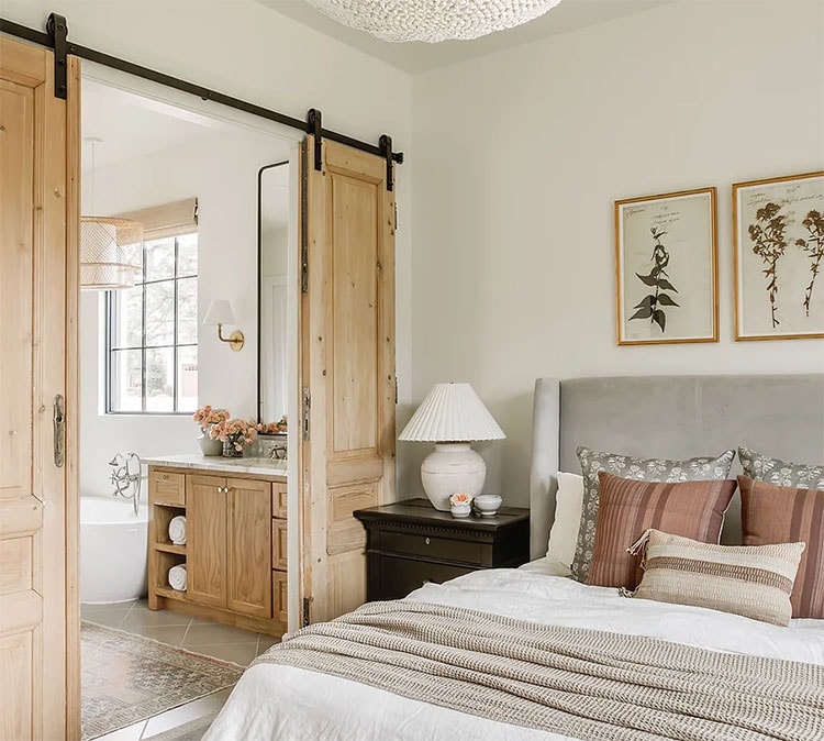 This beautiful bedroom design by Kelsey Leigh Design that opens up to the bathroom is so chic and cozy and inviting! #ABlissfulNest