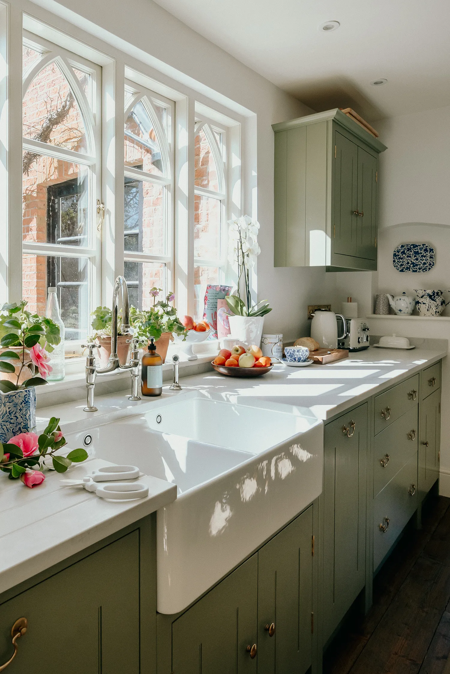 sage green kitchen cabinets with farmhouse sink