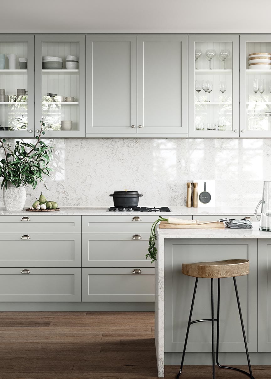 Light gray kitchen cabinets with marble countertop