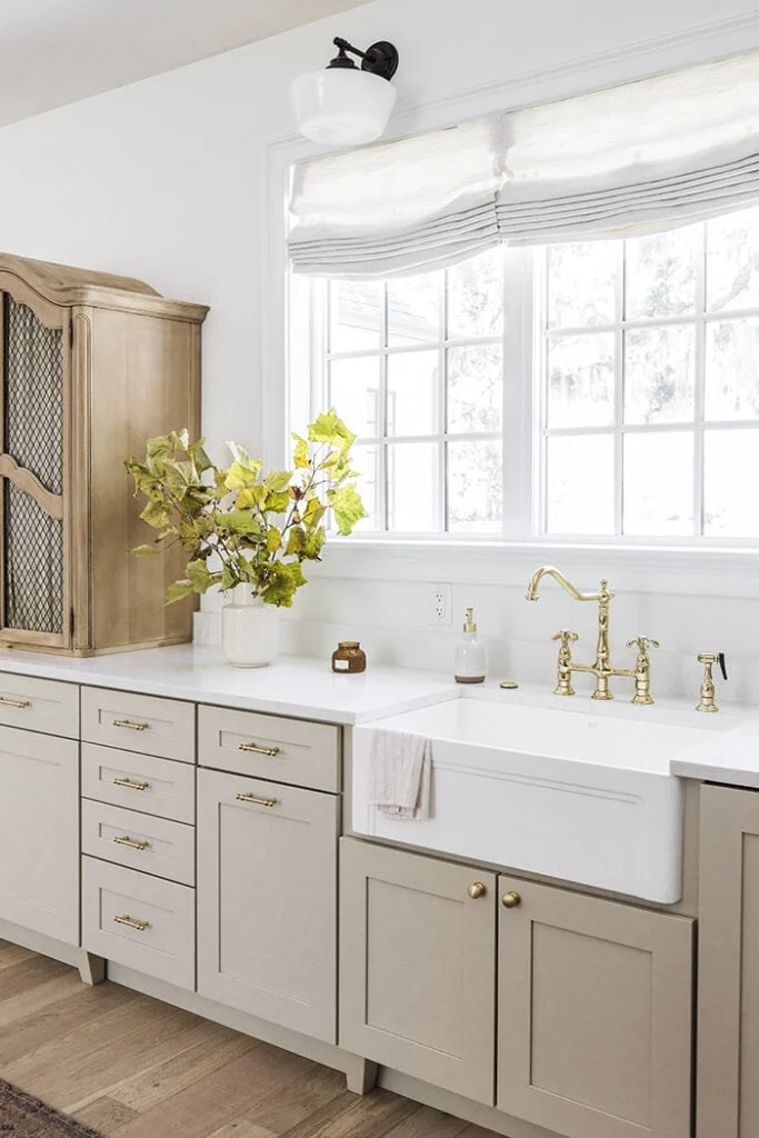 beige kitchen cabinets with gold hardware