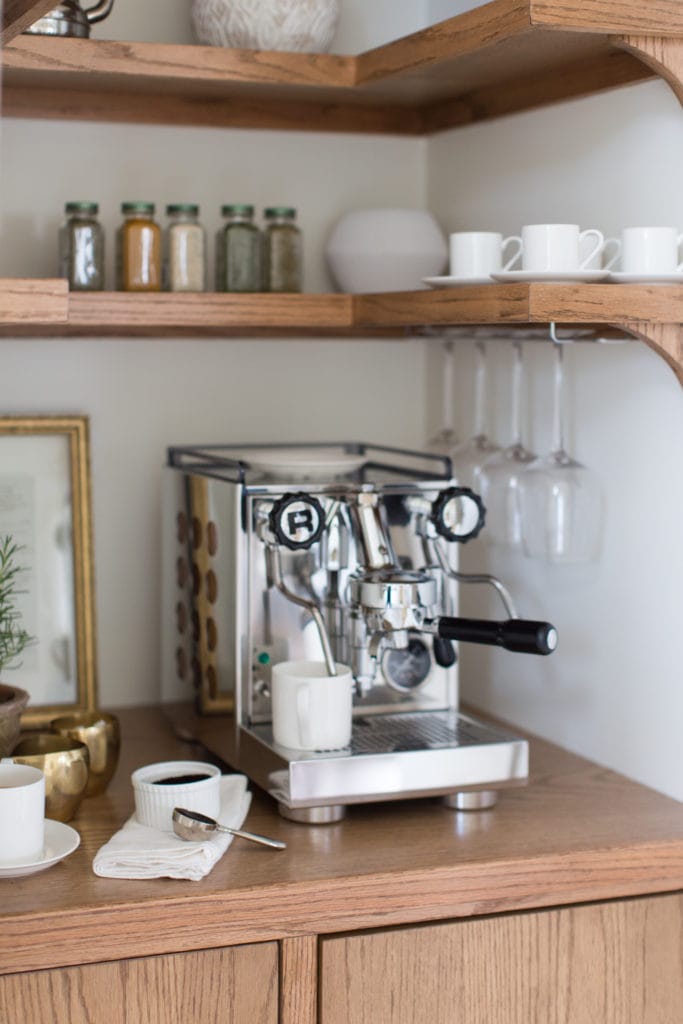espresso machine on a honey oak cabinet