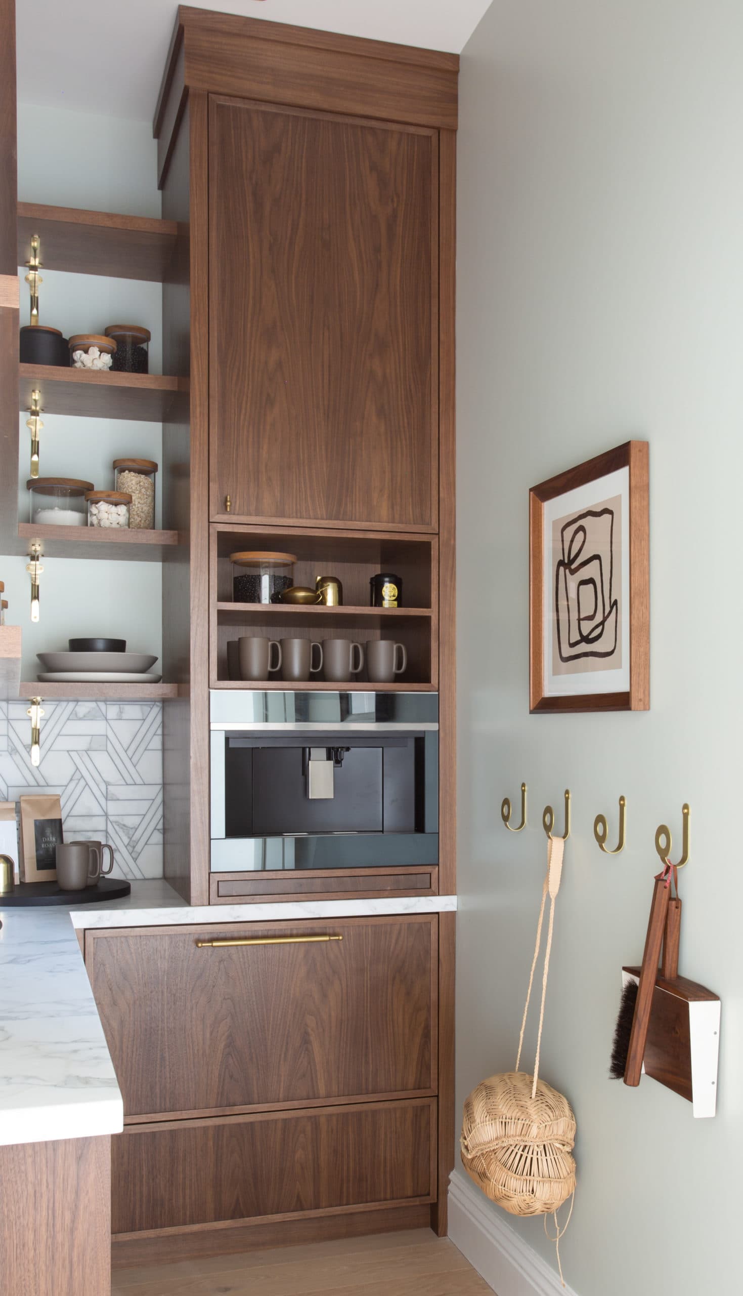 wood cabinets in a kitchen with a built in coffee machine
