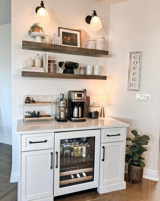 white cabinet with a drink refrigerator and a coffee bar set up on the counter