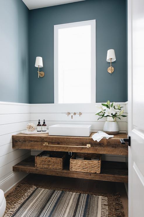 blue walls, shiplap, and a custom wood vanity with a raised sink in this farmhouse bathroom.