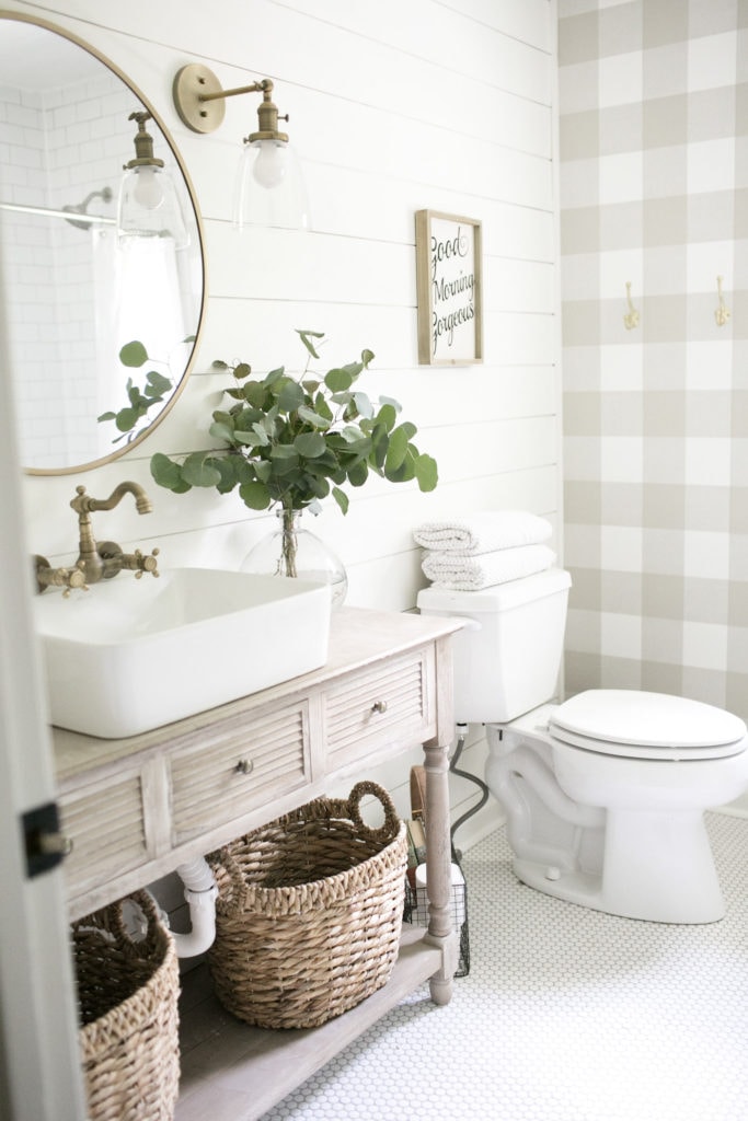 neutral plaid check wallpaper, farmhouse bath sink on top of a wood  vanity.