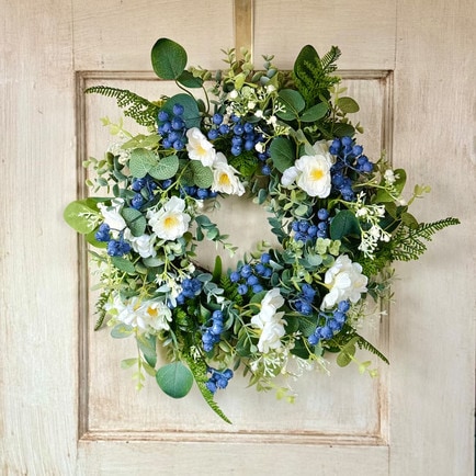 This blueberry and wildflower spring wreath is the perfect pop of color for your front door this spring! #ABlissfulNest