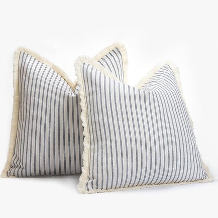 This navy striped throw pillow is under $15 and perfect for spring and summer! #ABlissfulNest