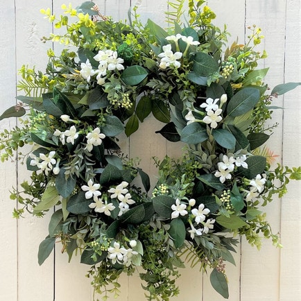 This white floral spring wreath is so perfect and neutral for your front door this season! #ABlissfulNest