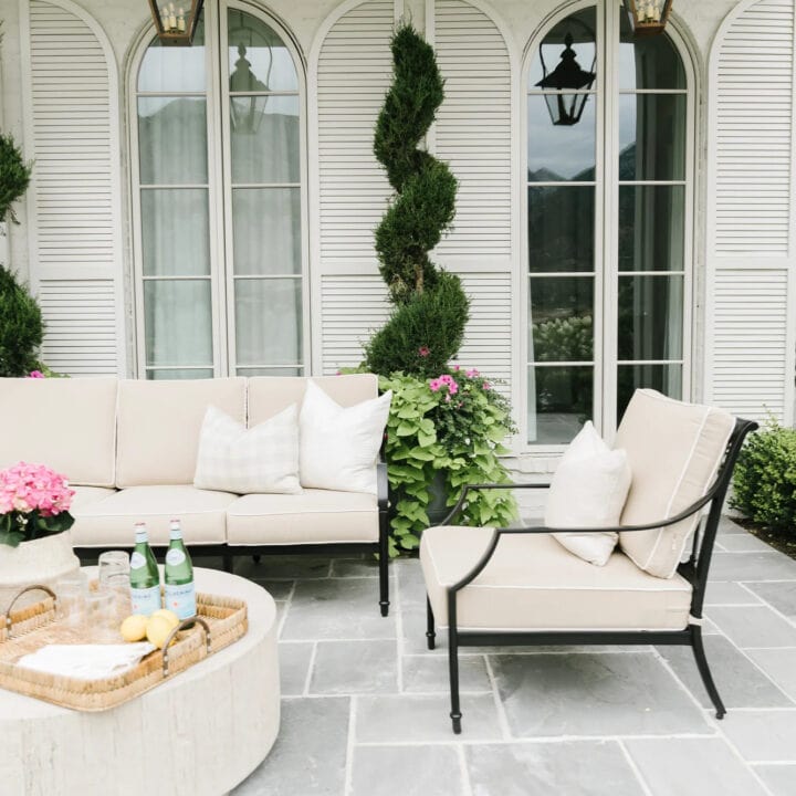 Image for Cozy Beige Seating & Lush Topiaries 