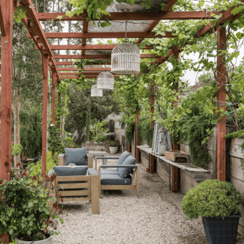 Image for Wood Pergola With Greenery Woven + Hanging Lanterns