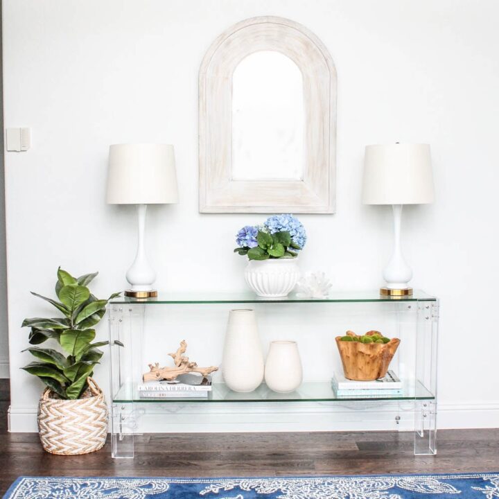 Image for Airy Glass Console With Soft Blue Accents + Greenery