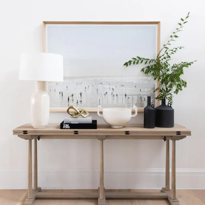 Image for Neutral Console Topped With Soft-Toned Beach Artwork + Greenery