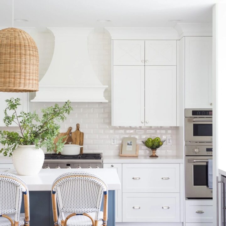 Image for Crisp White Kitchen With A Soft Blue Island + Greenery