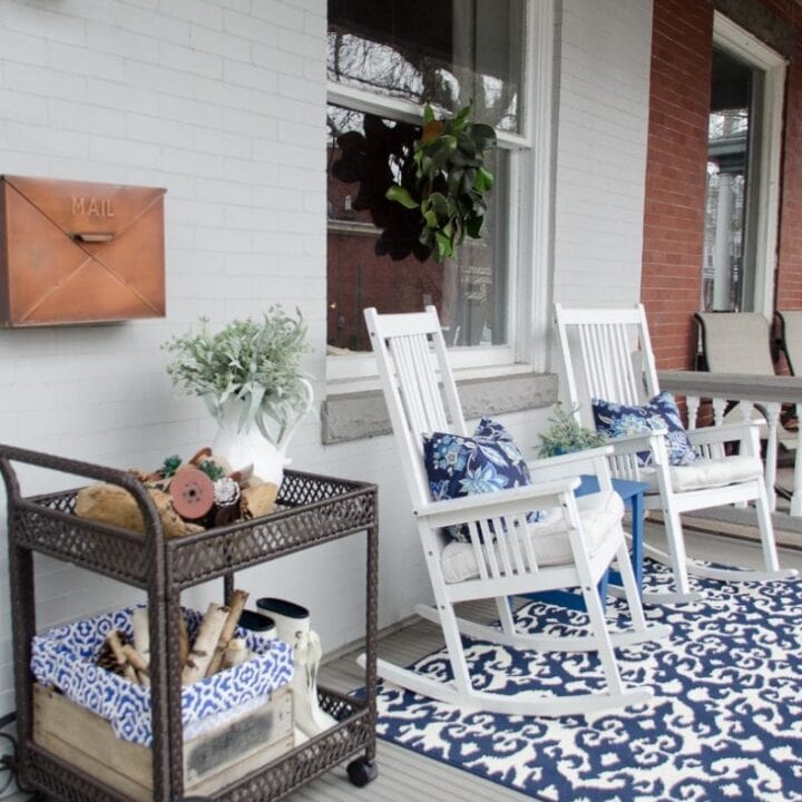 Image for White Rocking Chairs, Blue Patterned Rug And Accents