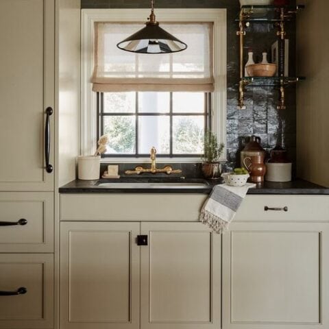 Image for Soft Beige Cabinets + Black Countertops & Brass Accents
