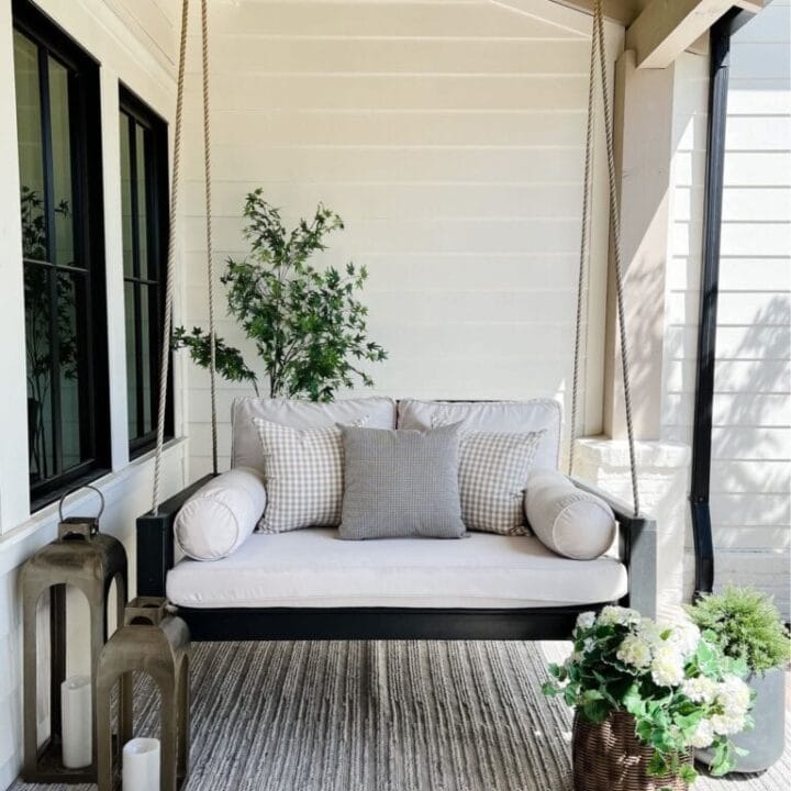 Image for Black Swing With Neutral Tone Cushions + Lanterns & Potted Plants