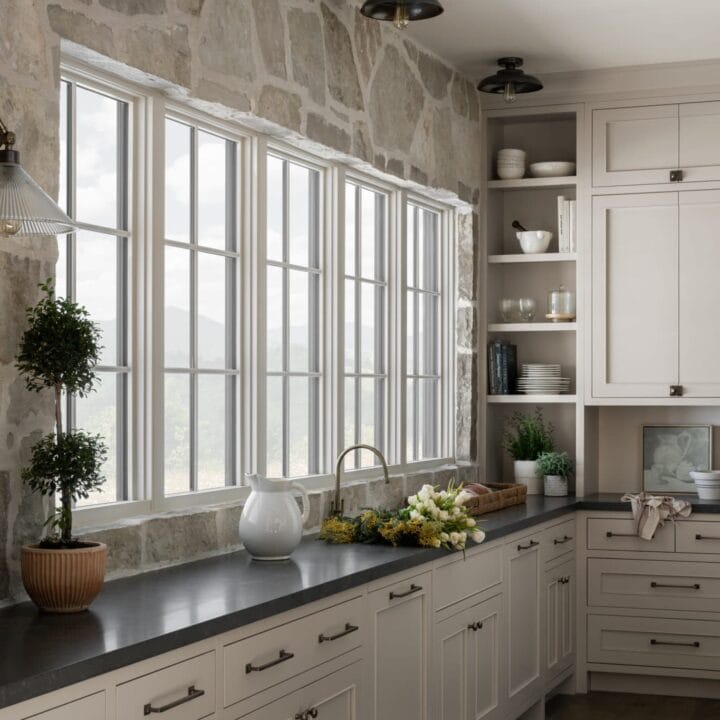 Image for Black Countertops & Hardware, Soft Beige Cabinets & Stone Accent Walls