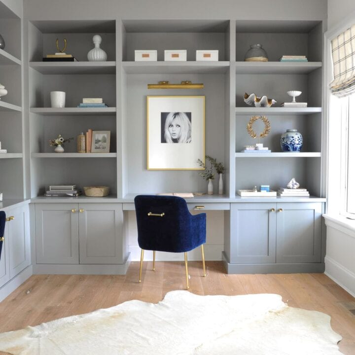 Image for Soft Gray Shelves With Gold Accents & Framed Artwork