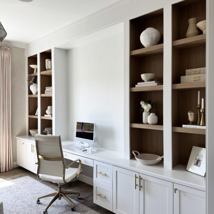 Image for White Cabinets With Warm Wood Backing & Sculptural Pieces