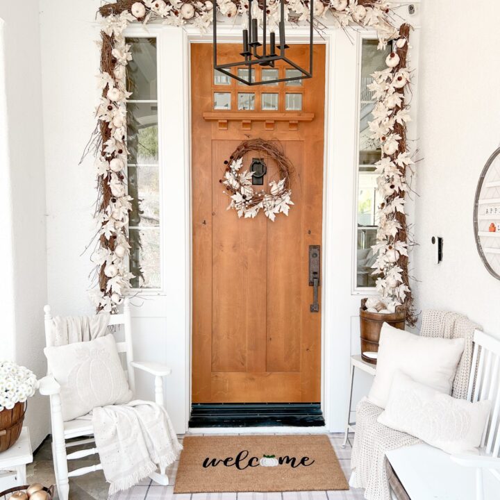 Image for Warm Wood Door, Soft White Garlands + Comfy Seating