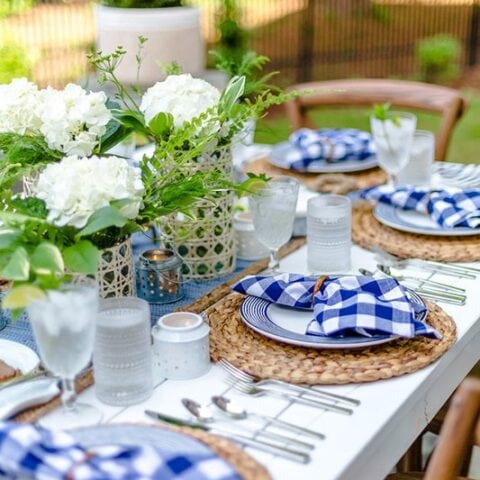 Image for Checkered Napkins, Woven Chargers + White Floral Centerpiece
