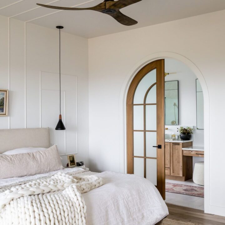 Image for Cozy Bed With Chunky Knit Blanket and Arched Wood Door