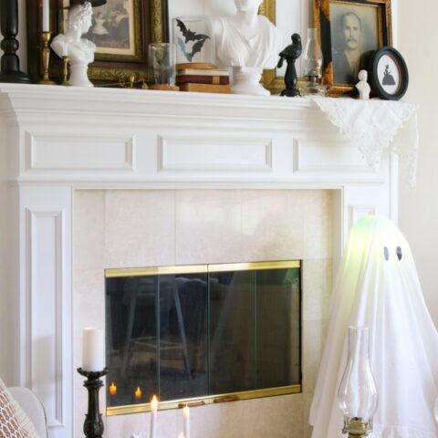 Image for Classy Halloween Mantel With Vintage Portraits & Sheet Ghost